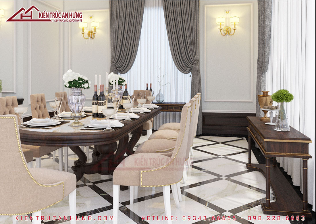 Một chiếc bàn elip dài bằng gỗ thiết kế đơn giản kết hợp với những chiếc ghế tựa bọc nỉ màu be thanh lịch, bàn gỗ để đồ, đèn tường, rèm che tạo thành điểm nhấn ấn tượng cho phòng ăn.